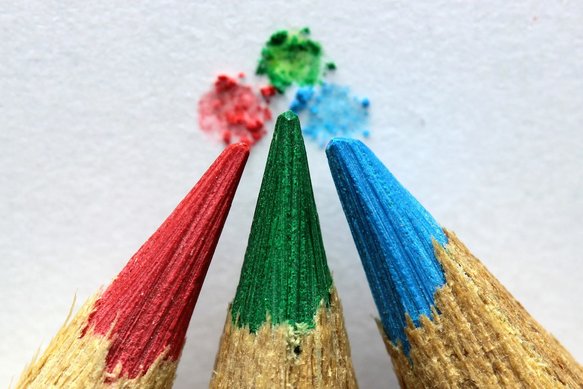 Close-up of red, green and blue crayon tips